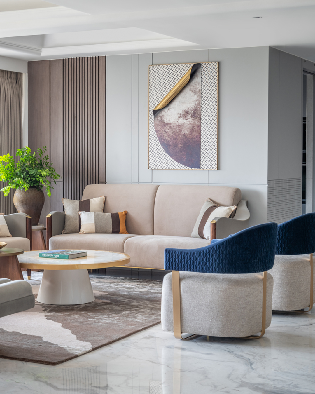 A residential living room with a large abstract work in brown and gold above the sofa — The Artemist, residential